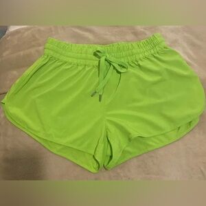 Aritzia TNA Lightweight neon green shorts